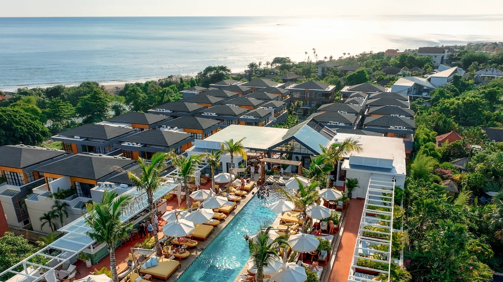 Aerial view of a beachfront resort complex in Berawa