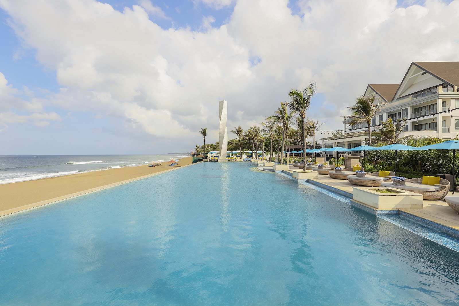 Beachfront infinity pool overlooking the ocean at Lv8 Resort Hotel