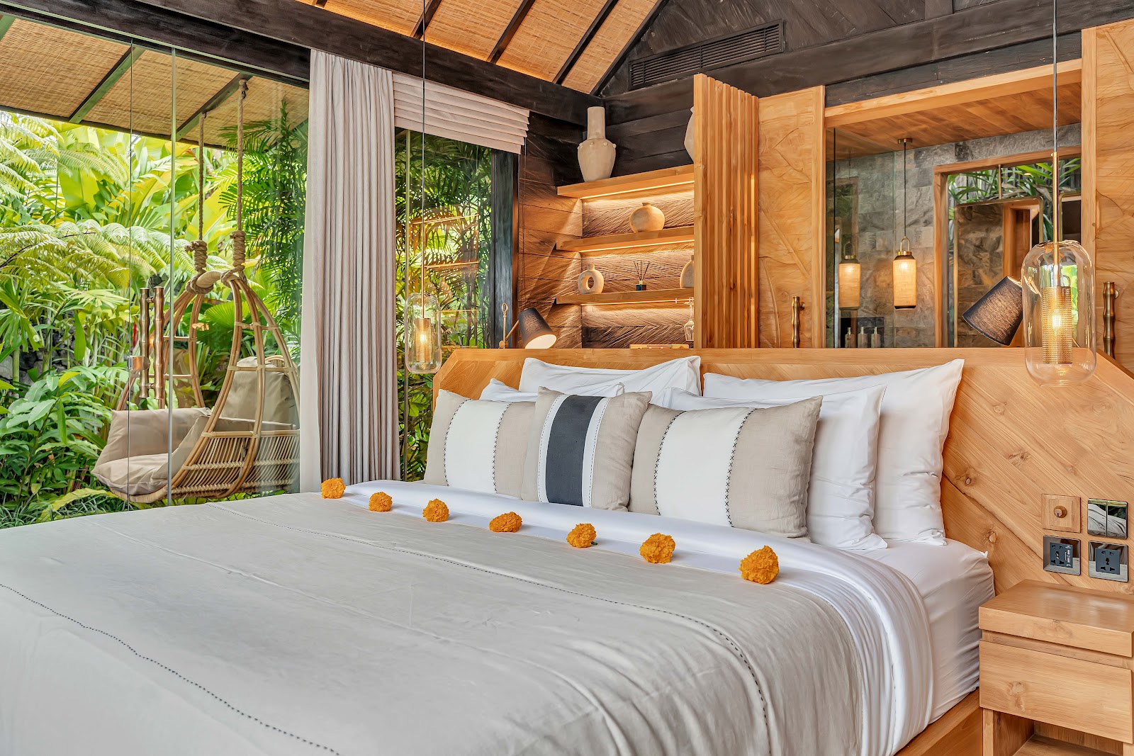 Cosy guest room with wooden furniture at Desa Hay