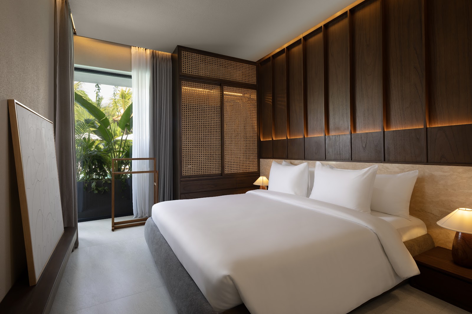 Modern guest room with a large bed at Elison Hotel Bali