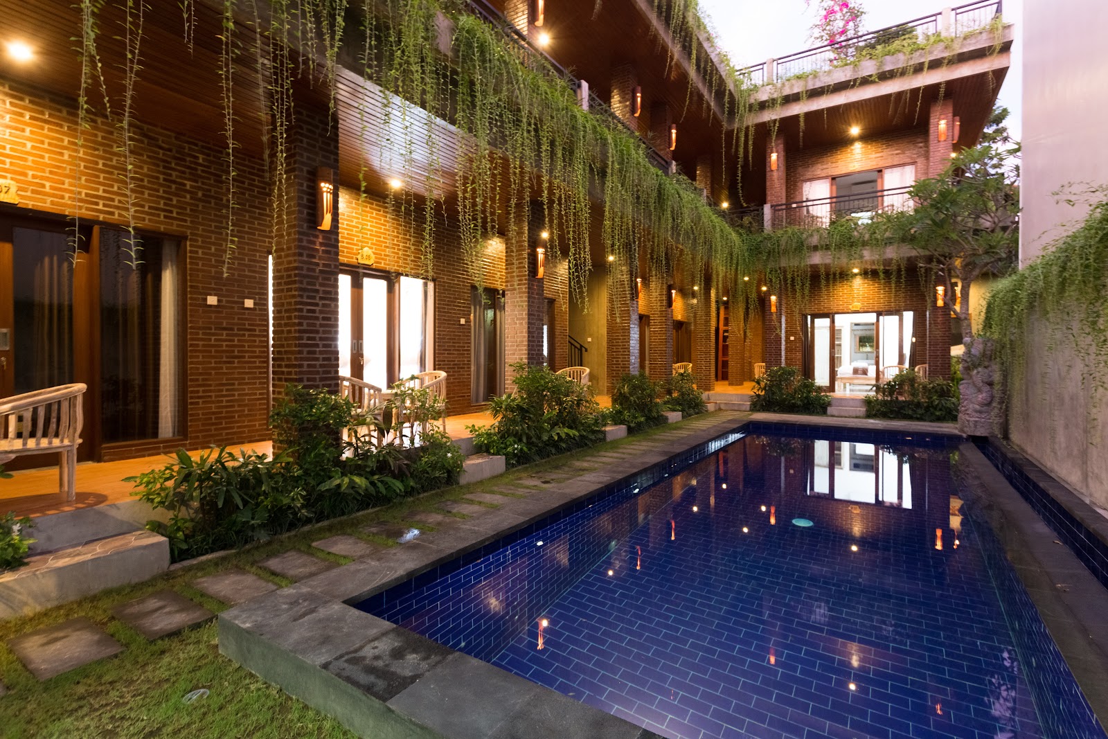 Narrow pool between rooms at The Ganesha Homestay and Warung