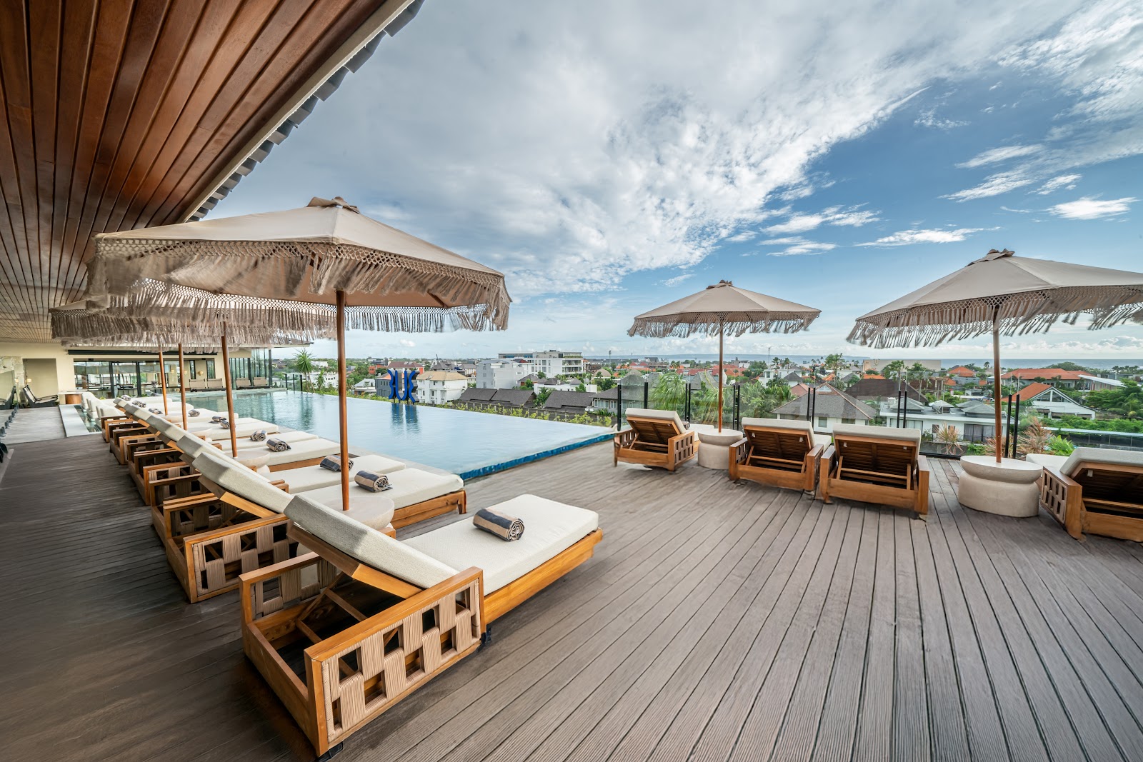 Poolside deck with daybeds at TUI BLUE Berawa Hotel and Villas