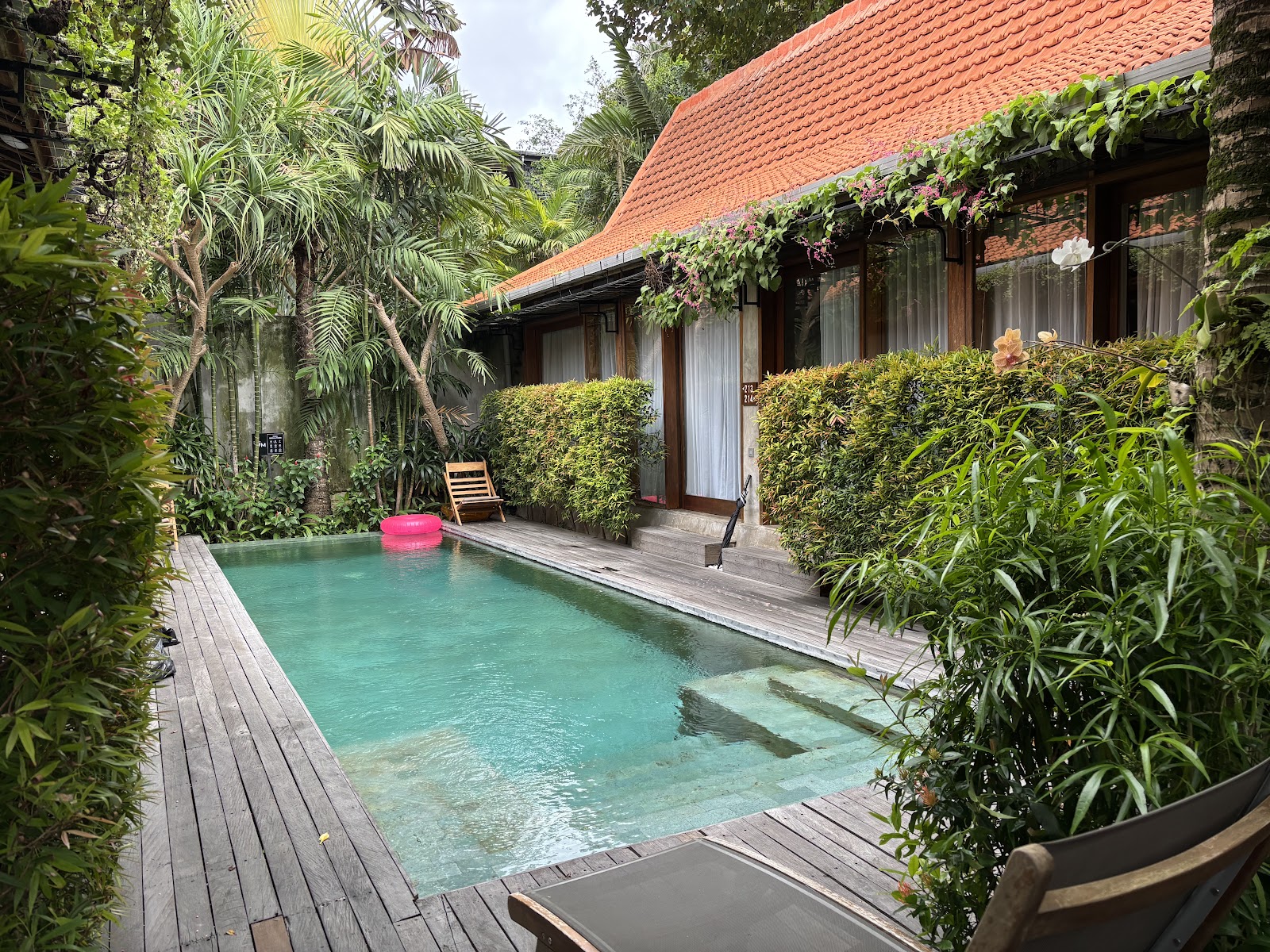 Private pool villa with tropical plants at ZIN Canggu Resort and Villas