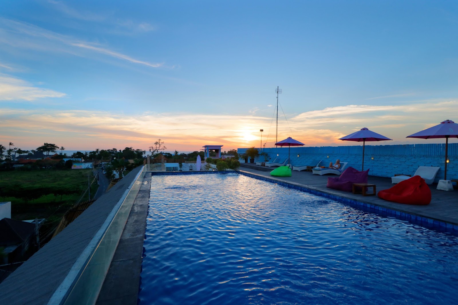 Rooftop pool at sunset at Koa D'Surfer Hotel