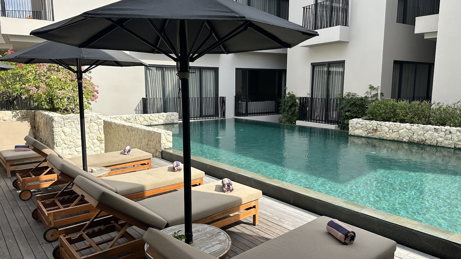 Swimming pool and daybeds at Aahana Village