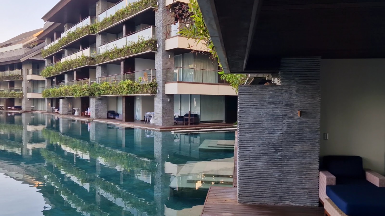Swimming pool beside the resort building at COMO Canggu