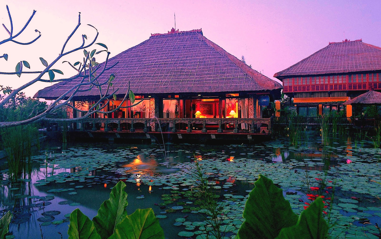 Traditional Balinese pavilions over a lotus pond at Hotel Tugu Bali