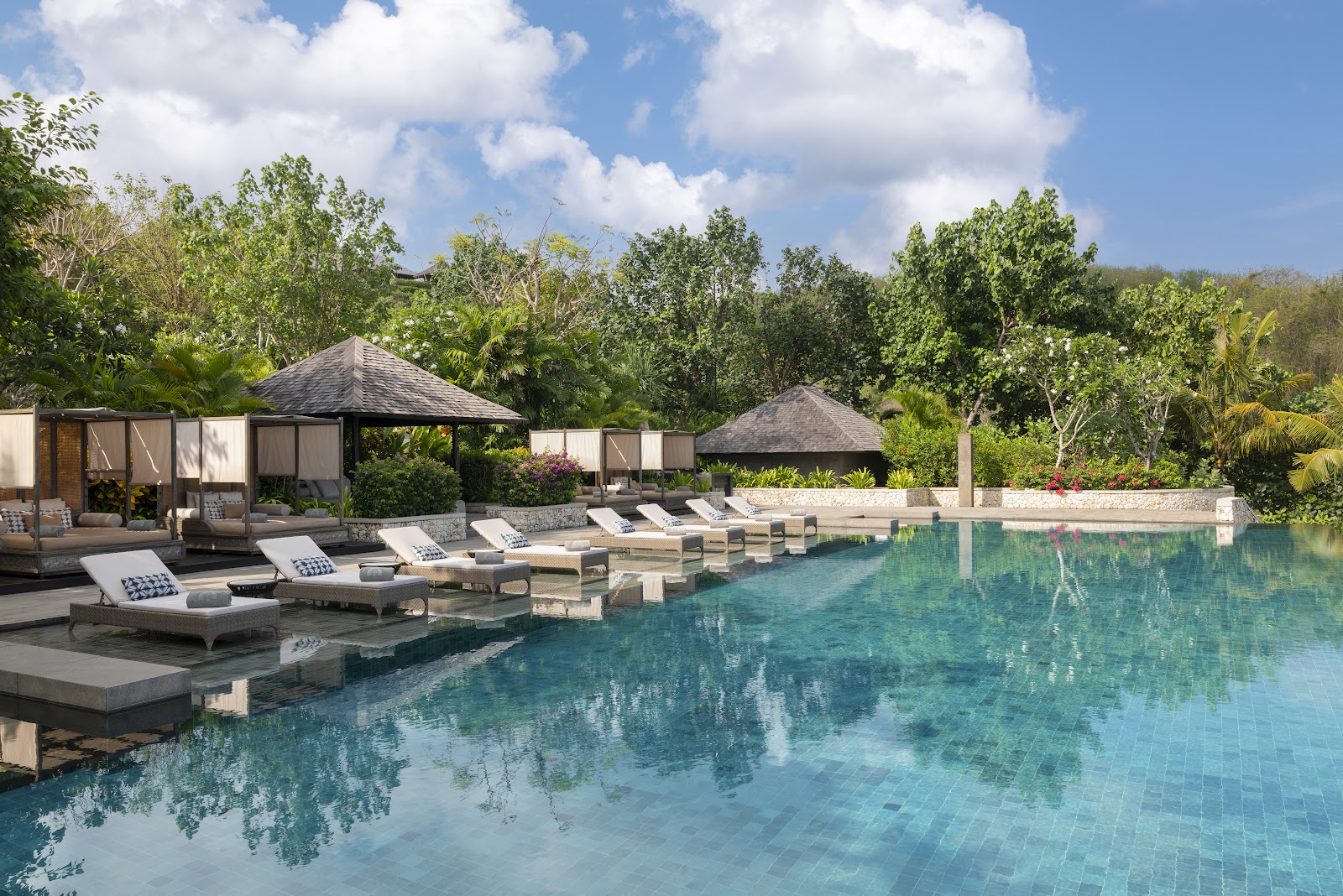 Villa pool and sun loungers at Raffles Bali in Jimbaran